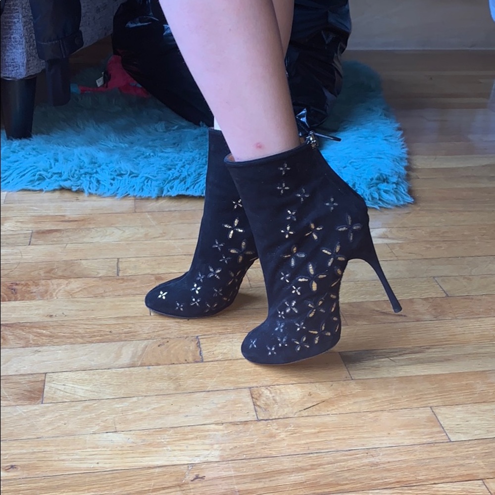 Alaia black boots with gold stars